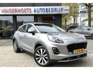 Ford Puma 125 Pk Titanium X Benzine * Navigatie * Adaptive Cruise Control * Achteruitrij Camera * 18" L.M. Velgen * Vingerhoets; Vierde Generatie Eersteklas Service. Al meer dan 100 jaar een begrip in de Brabantse Kempen.