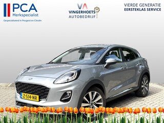 Ford Puma 125 Pk Titanium X Benzine * Navigatie * Adaptive Cruise Control * Achteruitrij Camera * 18" L.M. Velgen * Vingerhoets; Vierde Generatie Eersteklas Service. Al meer dan 100 jaar een begrip in de Brabantse Kempen.