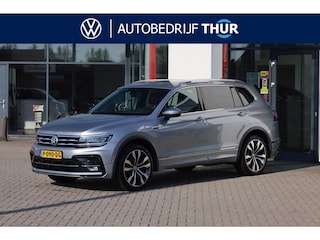 Volkswagen Tiguan 2.0 TSI 4Motion R-Line 7p 7 zits r-line in en exterieur panoramadak 20" LMV Suzuka head up display discover pro navi digital cockpit pro area view rondom zicht camera verwarmbare voorruit stoelverwarming elektrische achterklep keyless entry wegklapbare trekhaak side assist keyless entry VW Dealer onderhouden