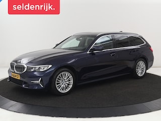 BMW 318i Luxury Line | Sportstoelen | Leder | Carplay | Live Cockpit | Sfeerverlichting | Trekhaak | Parkeerhulp | Climate control | Full LED | Cruise control | Bluetooth