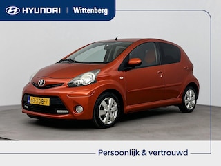 Toyota Aygo 1.0 VVT-i Dynamic Orange | All season | L.M. Velgen | Airco | Getint glas |