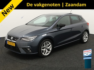 Seat Ibiza 1.0 TSI FR Business Intense Plus Apple Carplay/Android Auto, Draadloze telefoonlader, Elektrisch glazen panorama-dak, Parkeersensor voor en achter, Virtual cockpit, Voorstoelen verwarmd, Cruise control Deze SEAT Ibiza 1.0 TSI FR Business Intense Plus uit 2021 is een sportieve en complete hatchback die comfort en rijplezier perfect combineert. Dankzij de automatische transmissie rijd je moei