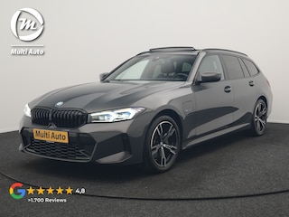 BMW 3-serie Touring 330e M Sport PHEV 293pk Dealer O.H. | Dravitgrau | Trekhaak Af Fabriek | Panodak | Head Up | Camera | Lederen Sportstoelen Verwarmd | Sfeerverlichting | Apple Carplay | Keyless | Blis | Cruise Control | Navigatie | DAB | Plug I