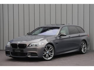 BMW 5-serie Touring M550xd | Luchtvering | Head-up | Massage | Bang&Olufsen | Entertainment achter | Keyless | Stoelkoeling | ACC | 2016.