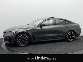 BMW i4 eDrive40 84 kWh M Sport Pro SOH 97,4% | Wegklapbare Trekhaak | 360° Camera | Harman/Kardon | Schuif\Kanteldak