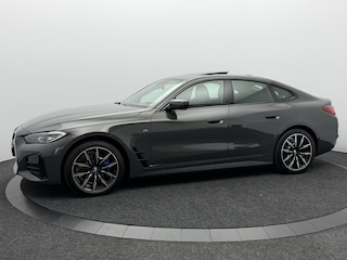 BMW i4 eDrive40 84 kWh M Sport Pro SOH 97,4% | Wegklapbare Trekhaak | 360° Camera | Harman/Kardon | Schuif\Kanteldak