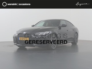 BMW i4 eDrive35 High Executive 70 kWh | M-Pakket | SOH 96% | HUD | Sportstoelen elektrisch verstelbaar + Geheugen | Camera | DAB | Apple CarPlay/Android Auto | Adaptieve Cruise Control | Ele. kofferdeksel |