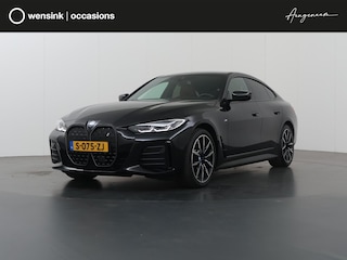 BMW i4 eDrive35 High Executive 70 kWh | M-Pakket | SOH 96% | HUD | Sportstoelen elektrisch verstelbaar + Geheugen | Camera | DAB | Apple CarPlay/Android Auto | Adaptieve Cruise Control | Ele. kofferdeksel |