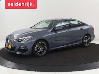 BMW 218i M Sport | Stoelverwarming | Camera | Carplay | Sportstoelen | Leder | Live Cockpit | Climate control | Navigatie | Cruise control | Parkeer hulp