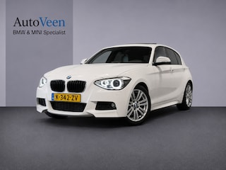BMW 118i High Executive (PANO, LED, STOELVERWARMING, GROOT NAVI, PARKEERSENSOREN)