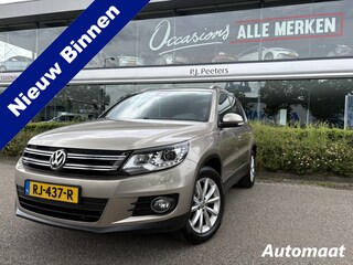 Volkswagen Tiguan 1.4 TSI R-Line Edition Airco - Apple carplay - Achteruitrijcamera - Parkeersensoren - Navigatie - Cruise control - Trekhaak - Dakrails - Led verlichting - Dakspoiler -  Licht metalen velgen 18 inch - Stuur multifun - Start/stop systeem - Radio - Bluetooth - mistlampen voor