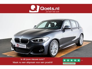 BMW 118i Edition M Sport Shadow High Executive Middenarmsteun - PDC Voor/achter - Cruise Control - Sportstoelen - Elektrisch verstelbare lendensteunen - Elektrisch verwarmde voorstoelen - Navigatiesysteem Business -
