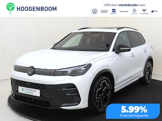 Volkswagen Tiguan 1.5 eHybrid R-Line Edition | SoH 98% | Panoramadak | Lederen bekleding ‘Varenna’ | Harman/kardon | Trekhaak | Head-up display | Black style | 360 camera | Adaptieve demping |