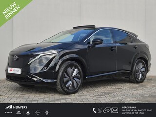 Nissan Ariya Evolve 66 kWh / SOH 99% / Glazen schuif- en kanteldak / CCS snelladen / warmtepomp / Stuur- Stoel & Achterbank verwarming / Head Up Display / Adaptief cruise control / Stoelventilatie / Bose Audio Systeem / Elektrische achterklep / Draadloze telefoon lader /