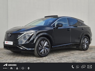 Nissan Ariya Evolve 66 kWh / SOH 99% / Glazen schuif- en kanteldak / CCS snelladen / warmtepomp / Stuur- Stoel & Achterbank verwarming / Head Up Display / Adaptief cruise control / Stoelventilatie / Bose Audio Systeem / Elektrische achterklep / Draadloze telefoon lader /