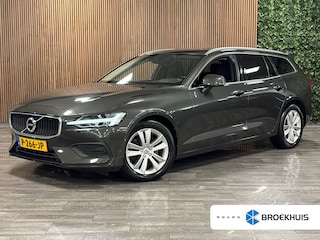 Volvo V60 B4 Aut. Business Edition | Trekhaak | Pine Grey! | Adaptieve Cruise Control | Stoel en Stuurwielverwarming | Parkeercamera | Pilot Assist | BLIS Dode Hoek Detectie | Lederen bekleding | Zitting verlenging voorstoelen | 17 Inch | Keyless Drive | Privacy Glass | 4-Voudig verstelbare lendesteun elektrisch | Parkeersensoren voor+achter | Elektrisch bedienbare achterklep | Draadloos telefoon opladen | DAB Radio | Apple Carplay/Android Auto | Climate Control L+R | Volvo On Call met mobiele App functie | Pine Grey Metallic |