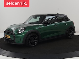 Mini Cooper 1.5 Business Edition | Harman/Kardon | Carplay | Verwarmde voorruit | Navigatie | Full LED | Half leder | Parkeerhulp | Climate control | Cruise control | Bluetooth | British Racing Green