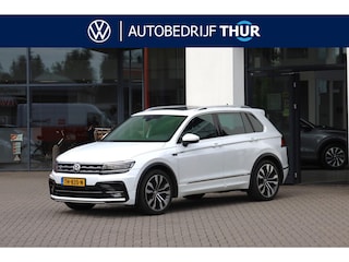 Volkswagen Tiguan 2.0 TSI 4Motion Highline NL auto 1e eigenaar door ons geleverd en onderhouden DYNaudio R Line in en exterieur 20" Suzuka panoramadak discover pro navigatie LED Plus adaptief keyless entry elektrische achterklep spiegel pakket winterpakket verwarmbare voorruit wegklapbare trekhaak