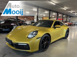 Porsche 992 911 3.0 Carrera S / 450 PK / Paint to Sample / PTS Yellow Storm / BOSE / Race-Tex / Alcantara / ACC / Sportuitlaat