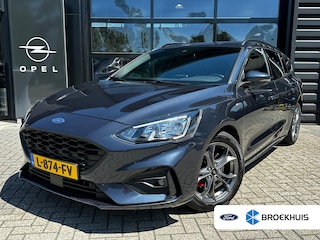 Ford Focus Wagon 1.5 150 PK Automaat ST Line X | TREKHAAK| LEDER| STUUR, STOEL EN VOORRUITVERWARMING| NAVIGATIE + APPLE CARPLAY/ANDROID AUTO| CAMERA + PARKEERSENSOREN| ELEK. KOFFERKLEP| DRAADLOZE TELEFOONLADER| DAB|