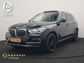 BMW X5 xDrive45e X Line PHEV 395pk Dealer O.H. | Trekhaak Af Fabriek | Panodak | Luchtvering | Head Up | Adaptive Cruise | Camera | Lederen Sportstoelen Memory & Verwarmd | Adaptief Onderstel | Sfeerverlichting | Keyless | Blis | Hifi | Plug In Hybrid |