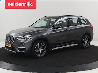 BMW X1 sDrive20i Orange Edition II | Leder | Trekhaak | Head-up | Park assist | Sfeerverlichting | Stoelverwarming | Climate control | Full LED | Navigatie |