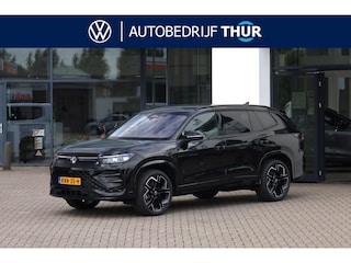 Volkswagen Tayron 1.5 eHybrid R-Line 60 maanden / 100.000km garantie blackstyle  Harman Kardon geluidssysteem, Head up LED Matrix (IQ.Lights), comfort pakket plus (verwarmbare voorstoelen, verwarmbare achterbank, verwarmbaar multifunctioneel lederen stuurwiel), wegklapbare trekhaak, rondomzichtcamera (area view), elektrische achterklep (Easy Open),  20" 'York' LMV, adaptief onderstel (dcc), black style pakket