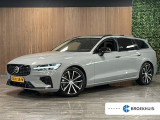 Volvo V60 T6 AWD Recharge Ultra Dark | Trekhaak | Schuifdak | Head-Up Display | Harman Kardon | Adaptieve Cruise Control | Stoelverwarming voor+achter | Stuurwielverwarming | Full LED Meesturende koplampen | Parkeercamera | Pilot Assist | BLIS Dode Hoek Detectie | Elektrische voorstoelen geheugen | Lederen bekleding | Zitting verlenging voorstoelen | Lederen dashboard | Google Infotainment | Keyless Drive | Parkeersensoren voor+achter | Privacy Glass | Elektrisch bedienbare achterklep | DAB Radio | Apple Carplay/Android Auto | Volvo On Call met mobiele App functie | Vapour Grey Metallic |