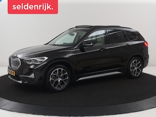 BMW X1 xDrive25e Business Edition Plus | SOH 91,4% | Panoramadak | Leder | Stoelverwarming | Sfeerverlichting | Cruise control | Navigatie | Park assist | PHEV