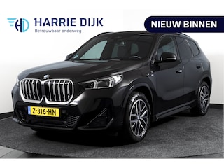 BMW X1 sDrive18i 136 PK | M-Sport | Afn. Trekhaak | Dig. Cockpit | Cruise | PDC | Camera | NAV + App. Connect | ECC | Elek. Klep | LM 18" |
