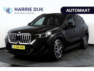 BMW X1 sDrive18i 136 PK | M-Sport | Afn. Trekhaak | Dig. Cockpit | Cruise | PDC | Camera | NAV + App. Connect | ECC | Elek. Klep | LM 18" |