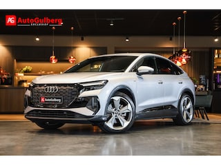 Audi Q4 40 S Black edition 77 kWh Sportstoelen Mono Pur Leder ruit met rood stiksel, ACC, Camera, Keyless, Sonos sound system, Spiegel/ Ambiente/ Veiligheids/ Smartphone/ Navi plus/ interieur/ Hulp/ Exterieur/ DynamicaComfortAirco, Sport design pakket, Lmv 21''
