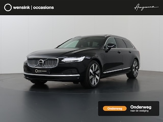 Volvo V90 2.0 T6 Plug-in hybrid AWD Plus Bright | Panoramadak | Trekhaak | Full Led Koplapen| Camera | Verwarmde achterbank | Apple CarPlay/Android Auto | Harman/Kardon Audio | Comfortstoelen | Adaptieve Cruise Control | DAB | Ele. verstelbare stoelen + Geheugen | Standkachel | LED | Navigatie | Sfeerverlichting | Stuur/stoelverwarming |