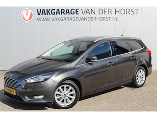 Ford Focus Wagon 1.0-125pk Titanium. Zeer nette, praktische en goed onderhouden wagen, afkomstig van de 1e eig. ! Autm. airco dual, cruise control, trekhaak, verwarmd voorraam, navigatie, telefoonvoorb., metallic lak, pdc v~a, LM wielen, All Season banden etc.