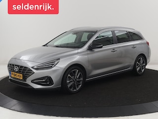 Hyundai i30 Wagon 1.5 T-GDi MHEV Premium | Leder | Stuur/stoel verwarming | Stoel ventilatie | Cruise control | Lane assist | Camera | Park assist | Climate control | Trekhaak