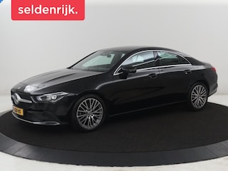 Mercedes-Benz CLA 180 Business Solution Luxury | Leder | Stoelverwarming | Cruise control | Sfeerverlichting | Navigatie | Bluetooth | Camera | Park assist | Climate control