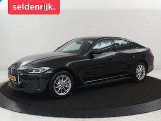 BMW i4 eDrive40 High Executive 84 kWh | SOH 98,7% | Leder | Adaptive cruise | Dodehoek detectie | Head-up | Stoelverwarming | Sfeerverlichting | Carplay | 3 zone klimaat | Camera | Park assist | Elektrische achterklep
