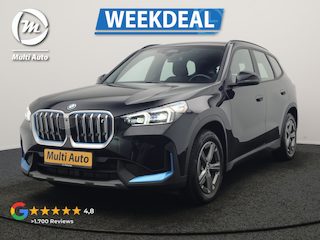 BMW iX1 xDrive30 67 kWh 313pk Dealer O.H. | Trekhaak Af Fabriek | Camera | Adaptief M Onderstel | Voorstoelen Verwarmd | Blis | Keyless | Apple Carplay | Adaptive LED | Sfeerverlichting | Widescreen Navi | DAB |