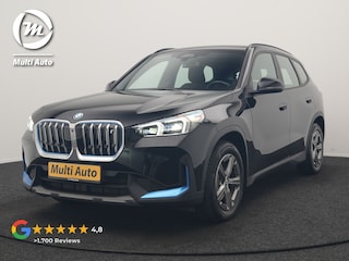 BMW iX1 xDrive30 67 kWh 313pk Dealer O.H. | Trekhaak Af Fabriek | Camera | Adaptief M Onderstel | Voorstoelen Verwarmd | Blis | Keyless | Apple Carplay | Adaptive LED | Sfeerverlichting | Widescreen Navi | DAB |