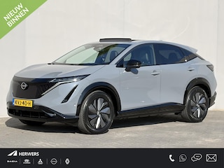 Nissan Ariya e-4ORCE Evolve 91 kWh 4WD / 306 PK / Leder / 1.500 kg Trekgewicht / Warmtepomp / 10 jaar Nissan More Garantie / Stoelverwarming voor en achter / Schuif-kantel dak / Stoelventilatie / Stuurverwarming / Rondomzicht camera / Elektrisch verstelbare stoelen met geheugen / Elektrische achterklep / Adaptieve cruise control / Apple Carplay/Android Auto /