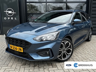 Ford Focus Wagon 1.0 125 PK ST Line | TREKHAAK| STOEL, STUUR EN VOORRUITVERWARMING| 18" LM-VELGEN| NAVIGATIE + APPLE CARPLAY/ANDROID AUTO| KEYLESS ENTRY & START| PARKEERSENSOREN ACHTER| DEALER ONDERHOUDEN|