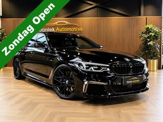BMW M550i xDrive High Executive Bom vol | leder | beeldschermen achterin | en een adembenemend geluid