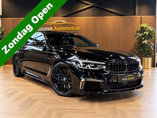 BMW M550i xDrive High Executive Bom vol | leder | beeldschermen achterin | en een adembenemend geluid