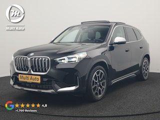 BMW iX1 xDrive30 X Line 67 kWh 313pk Dealer O.H. | Trekhaak Af Fabriek | Panodak | Head Up | Adaptive Cruise | 360 Camera | Harman / Kardon | Lederen Sportstoelen Massage & Memory | Keyless | Sfeerverlichting | Stoelen & Stuur Verwarmd | Apple Carplay | Widescreen Navi | DAB | 19"L.M |