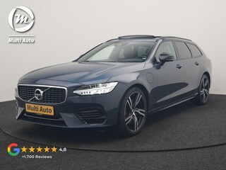 Volvo V90 T8 AWD R-Design PHEV 394pk Dealer O.H. | Trekhaak Af Fabriek | Four C Luchtvering | Panodak | Adaptive Cruise | Head Up | 360 Camera | Bowers & Wilkins | Lederen Sportstoelen Massage & Ventilatie & Memory | Stoelen & Stuur Verwarm Apple Carplay | Navigatie | DAB | 20"L.M | Plug In Hybrid |