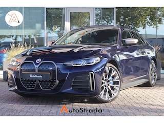 BMW i4 (g26) M50 544pk High Executive SoH 94% | Tansanietblau | Pano | 360 CAM | Laser | Harman/Kardon | Trekhaak |