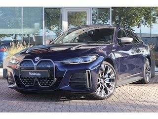 BMW i4 (g26) M50 544pk High Executive SoH 94% | Tansanietblau | Pano | 360 CAM | Laser | Harman/Kardon | Trekhaak |