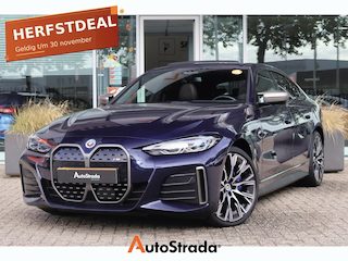 BMW i4 (g26) M50 544pk High Executive SoH 94% | Tansanietblau | Pano | 360 CAM | Laser | Harman/Kardon | Trekhaak |