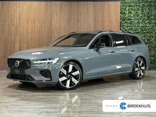 Volvo V60 T6 AWD Recharge Plus Dark | Schuifdak | 360 Camera | Harman Kardon | Adaptieve Cruise Control | Stoelverwarming voor+achter | Stuurwielverwarming | Full LED Meesturende koplampen | Pilot Assist | BLIS Dode Hoek Detectie | Elektrische voorstoelen geheugen | R-Design Contour Stoelen met wit stiksel en bies | Zitting verlenging voorstoelen | 19 Inch | Google Infotainment | Keyless Drive | Parkeersensoren voor+achter | Privacy Glass | Elektrisch bedienbare achterklep | DAB Radio | Apple Carplay/Android Auto | Volvo On Call met mobiele App functie | Thunder Grey Metallic |