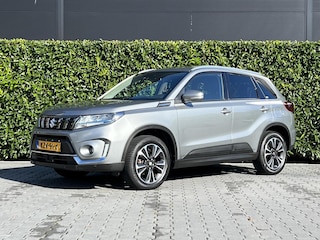 Suzuki Vitara 1.4 Boosterjet Style Smart Hybrid, 1E EIGENAAR, PANORAMADAK, NAVIGATIE, ADAPT. CRUISE, CLIMATE CONTROL, STOELVERWARMING, KEYLESS, CAMERA, PDC, LED, DAB, DEALER ONDERHOUDEN, LICHTMETAAL 17"